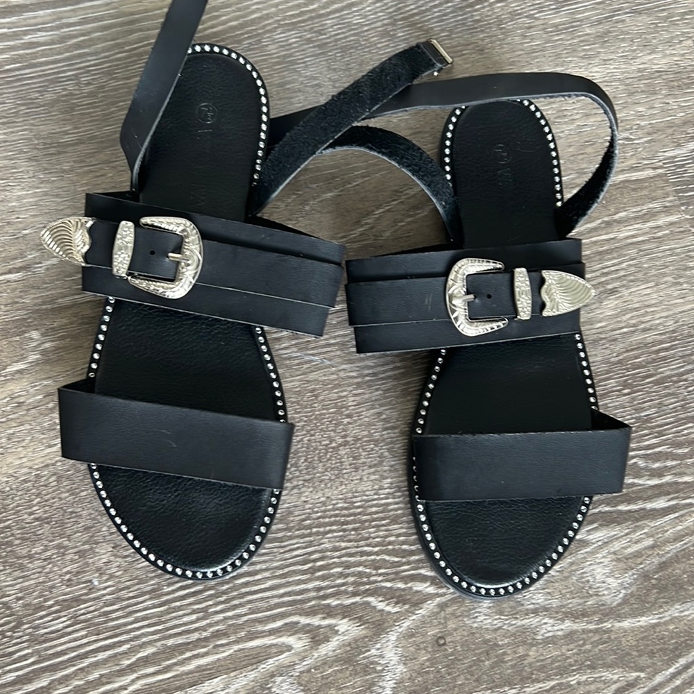 strappy sandal never been worn. has silver buckle